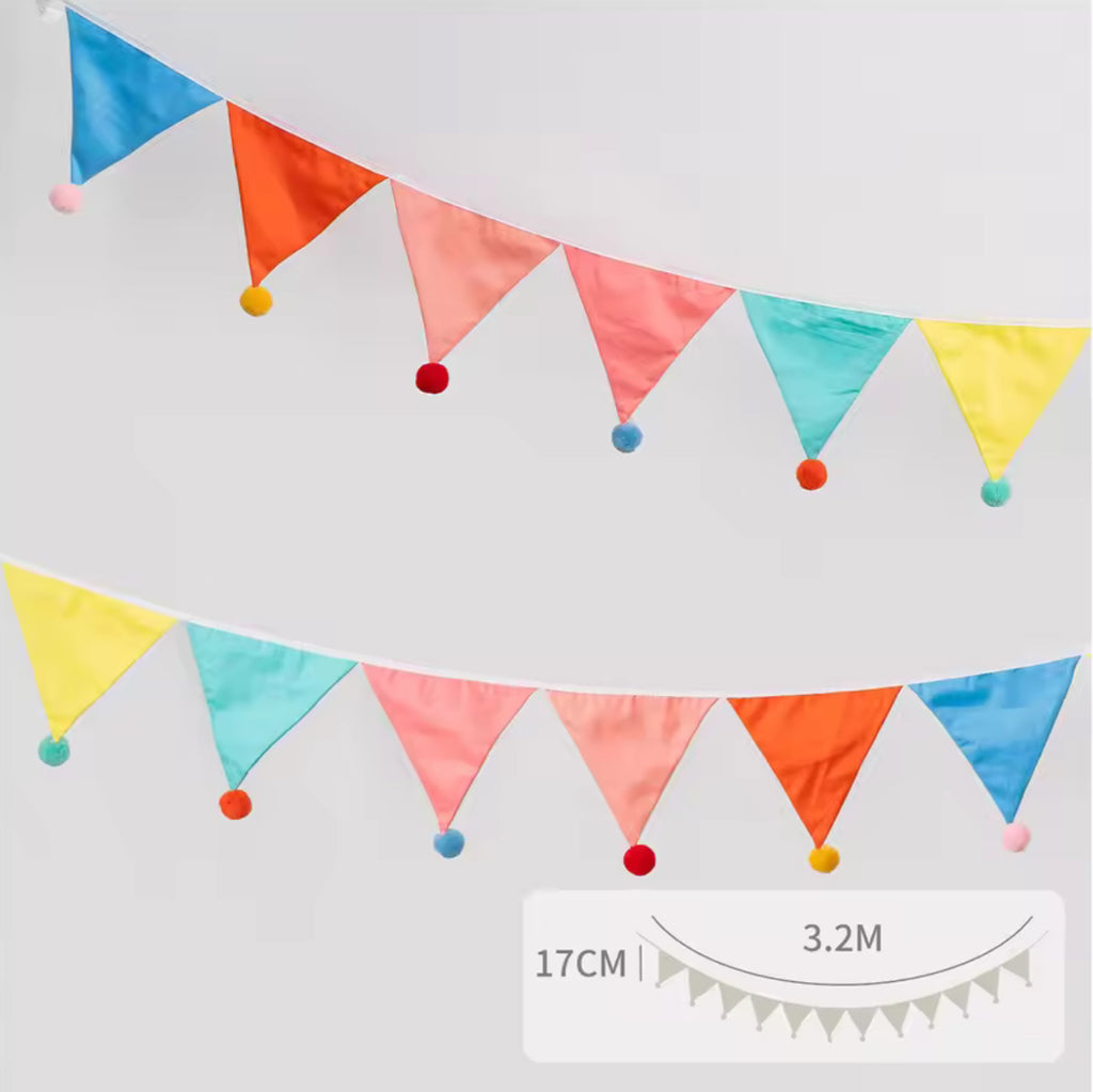 Reusable cotton flag bunting, in bright unisex colours with pom poms
