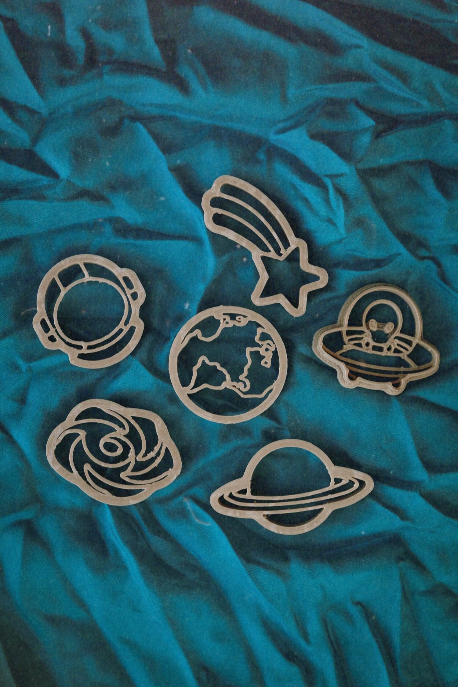 Kinfolk pantry mini outer space eco cutters set on blue fabric, ideal for environmentally friendly party bags